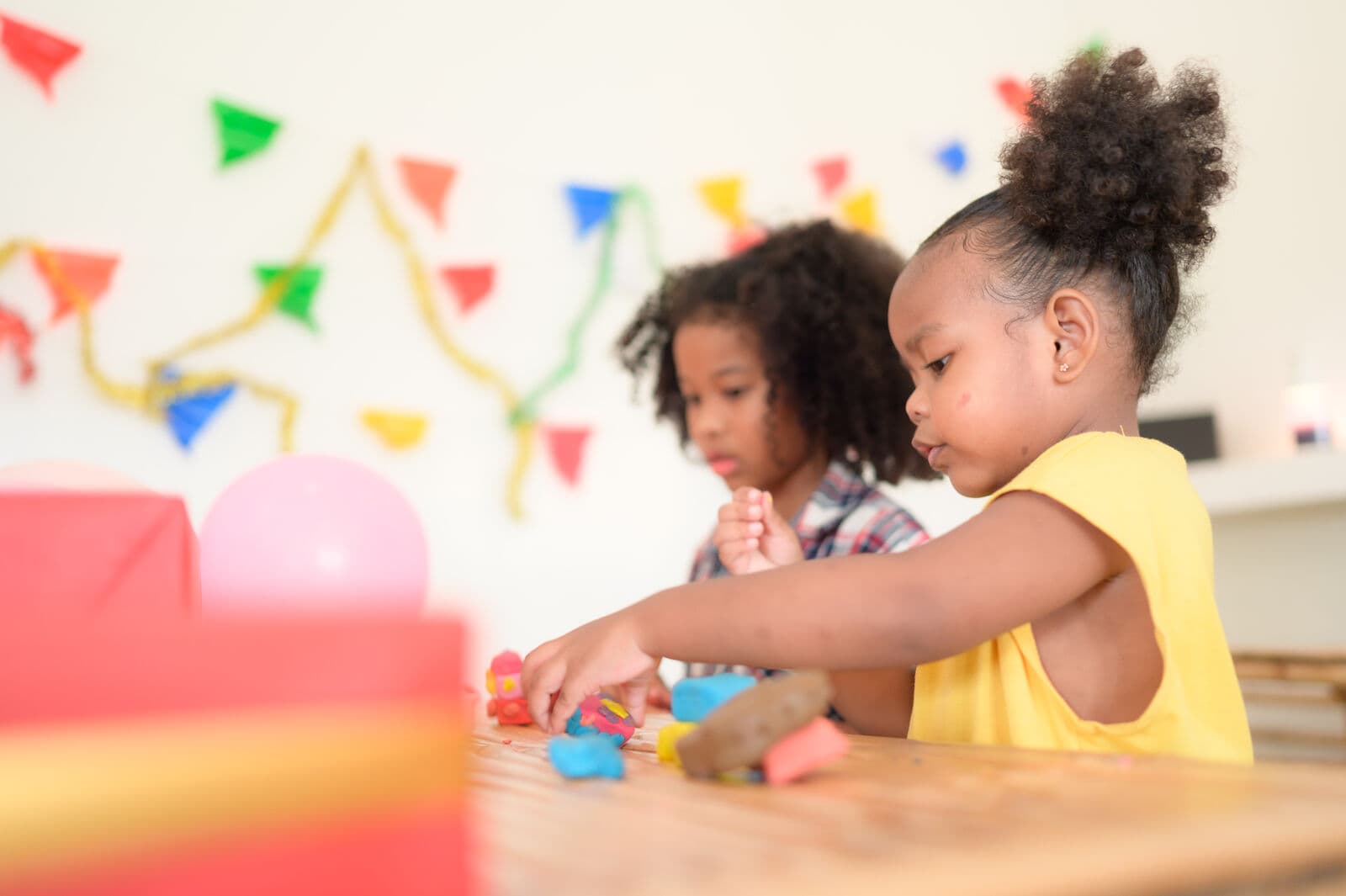 Children having fun with colorful clay